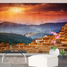Murales atardecer montañas pared rota