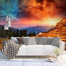 Murales efecto pared rota atardecer montañas