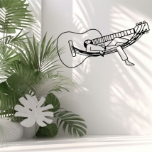 Vinilos adhesivos hombre durmiendo en una guitarra